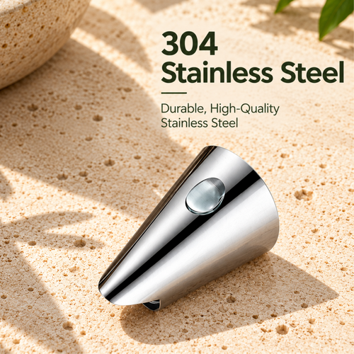 Polished metal finger guard and nut opener on a beige stone surface