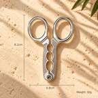 Stainless steel pistachio opener pliers measuring 8.2 × 6.8 cm and weighing 32 g